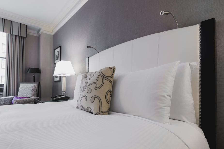 bright-hotel-room-bed (1).jpg